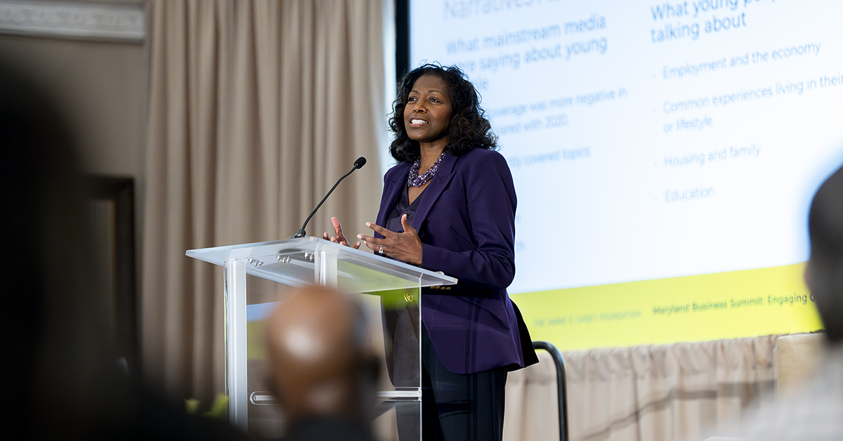 Lisa Hamilton stands at the lectern and speaks at the Maryland Business Summit