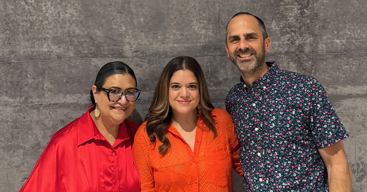 Kassi stands in the middle of two colleagues from VIDA Collaborative: on the left is Celia Godinez-Sánchez, Administrative Manager, and on the right is Larkin Tackett, Co-Owner and Executive Advisor