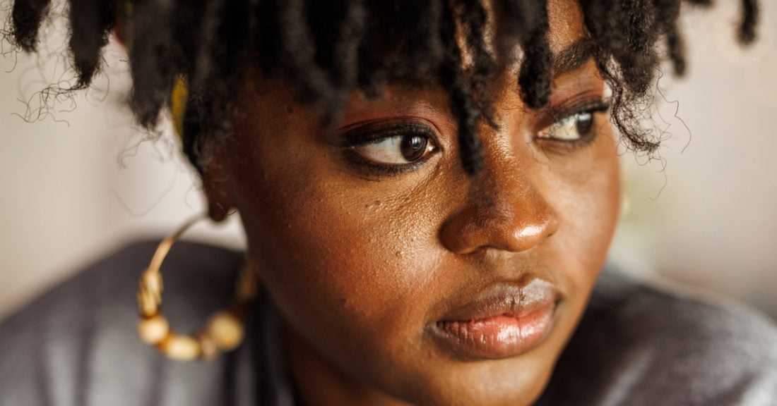 A closeup photo of a young black woman's face