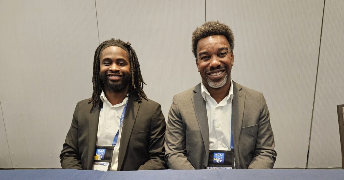 Elijah Norris-Holliday (left) and Steve Bishop (right) attend the 2024 Office of Juvenile Justice and Delinquency Prevention's 2024 National Conference on Youth Justice.