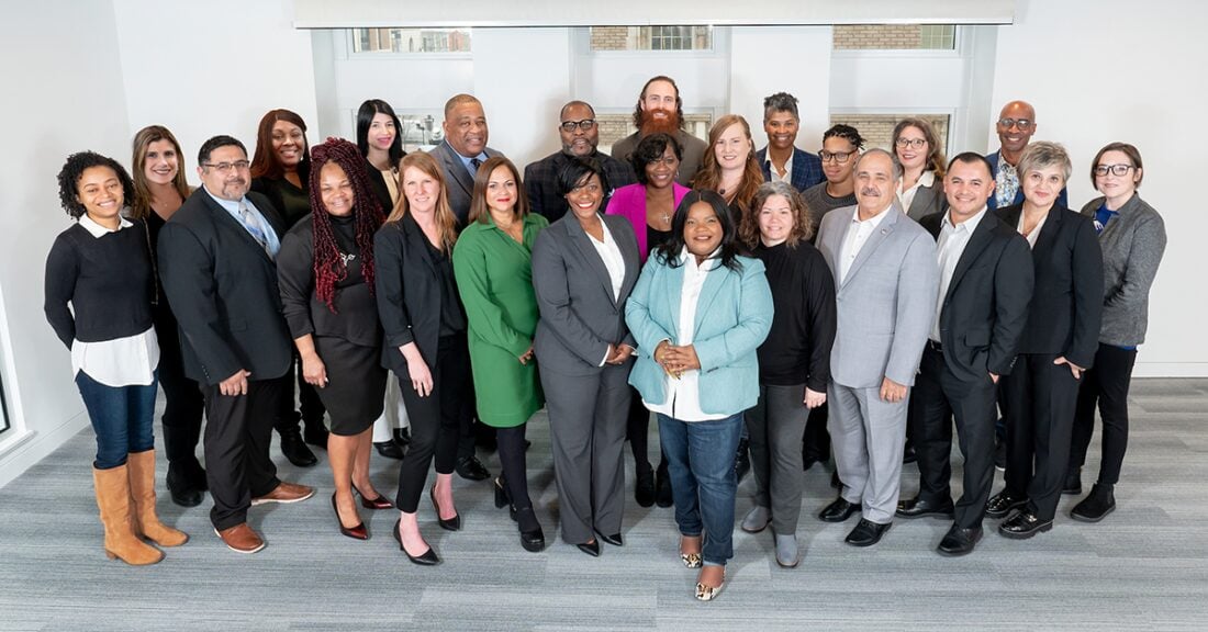A group photo of participants in the Casey Foundation’s Juvenile Justice Applied Leadership Network, standing together and smiling in a bright indoor setting.