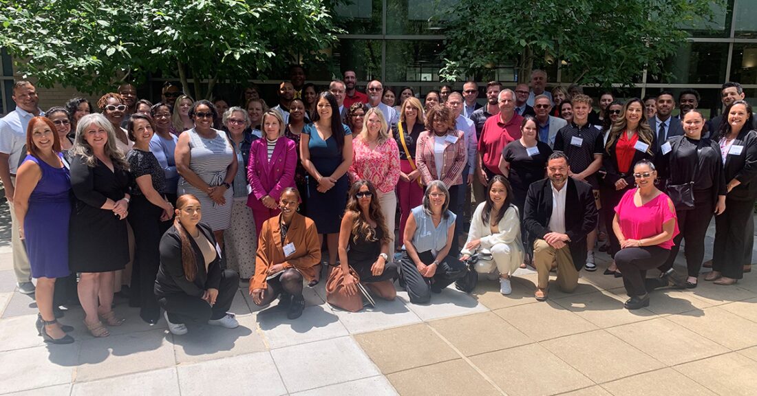 Group photo of past participants in the Transforming Juvenile Probation Certificate Program posing outdoors.