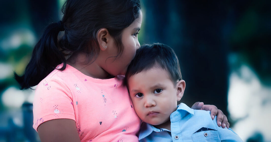 Sister comforts brother