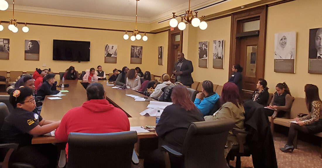 Young people attend a meeting