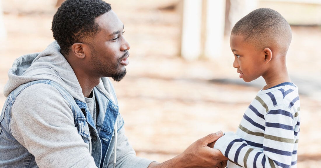 Father talks with young son