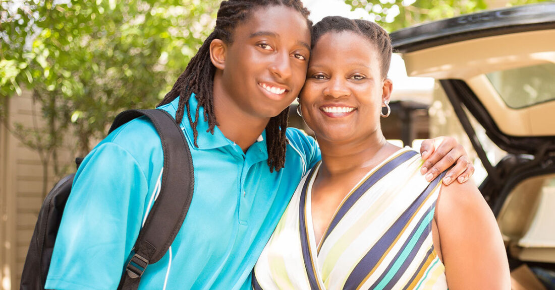 African American teenager with his mother