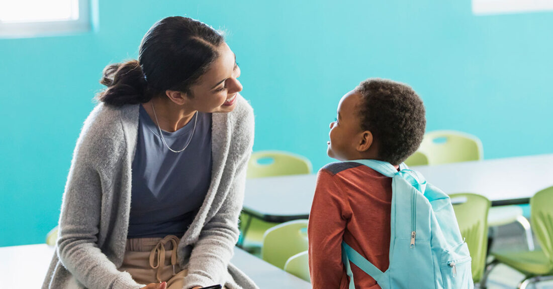 Caseworker talks with a child as part of an investigation