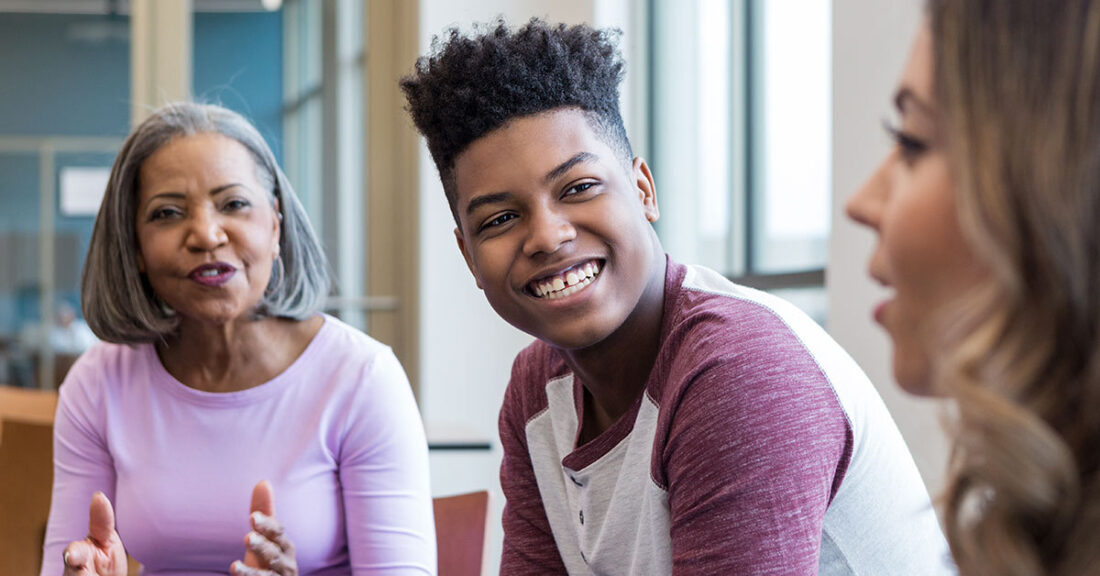 Young person talks with family about future plans