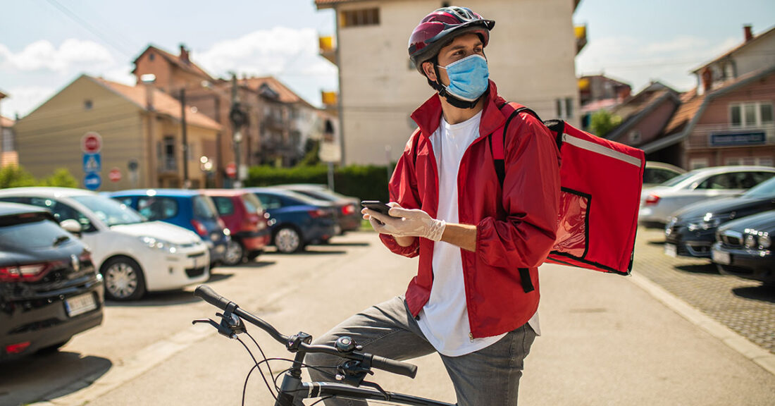 Young person making deliveries during the COVID-19 pandemic.