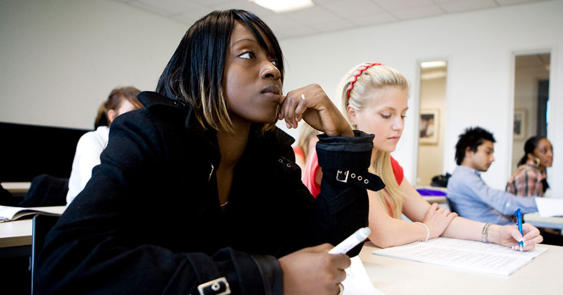 Students in a classroom listening to a lecture