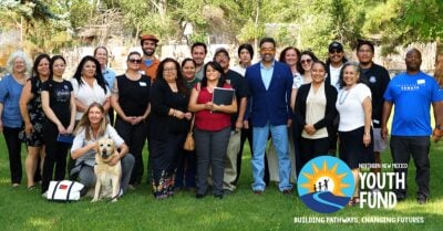Group photo of Northern New Mexico Youth Fund staff and community partners standing on a lawn.