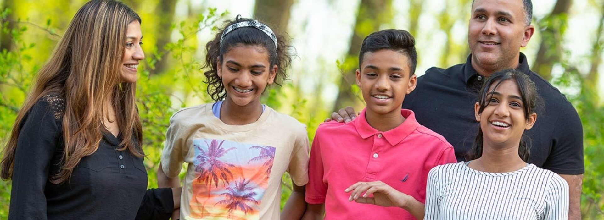 An Indian American family with a mom and dad and three teen children