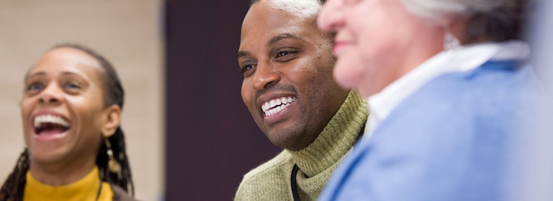 Three leaders in the human services field meeting