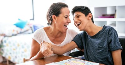 KIDS COUNT Data Book cover shows mom interacting with teenage son at table
